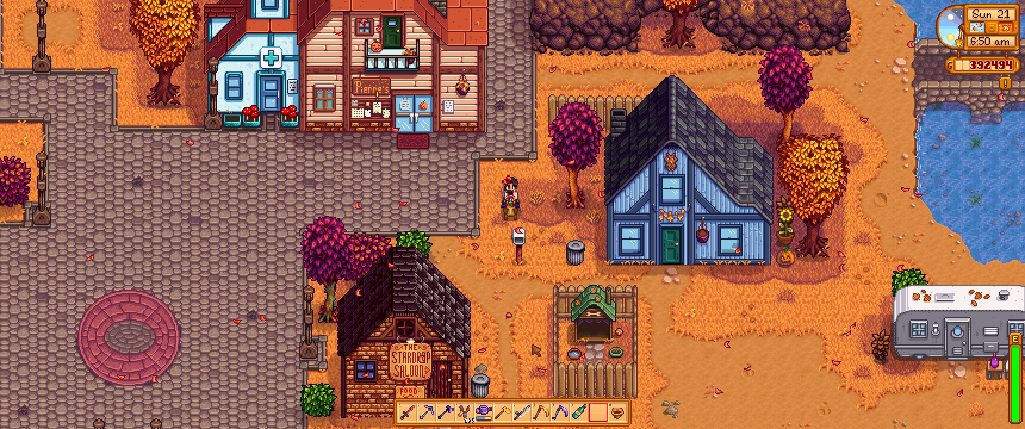 Stardew Valley: The player rides horseback through Pelican Town