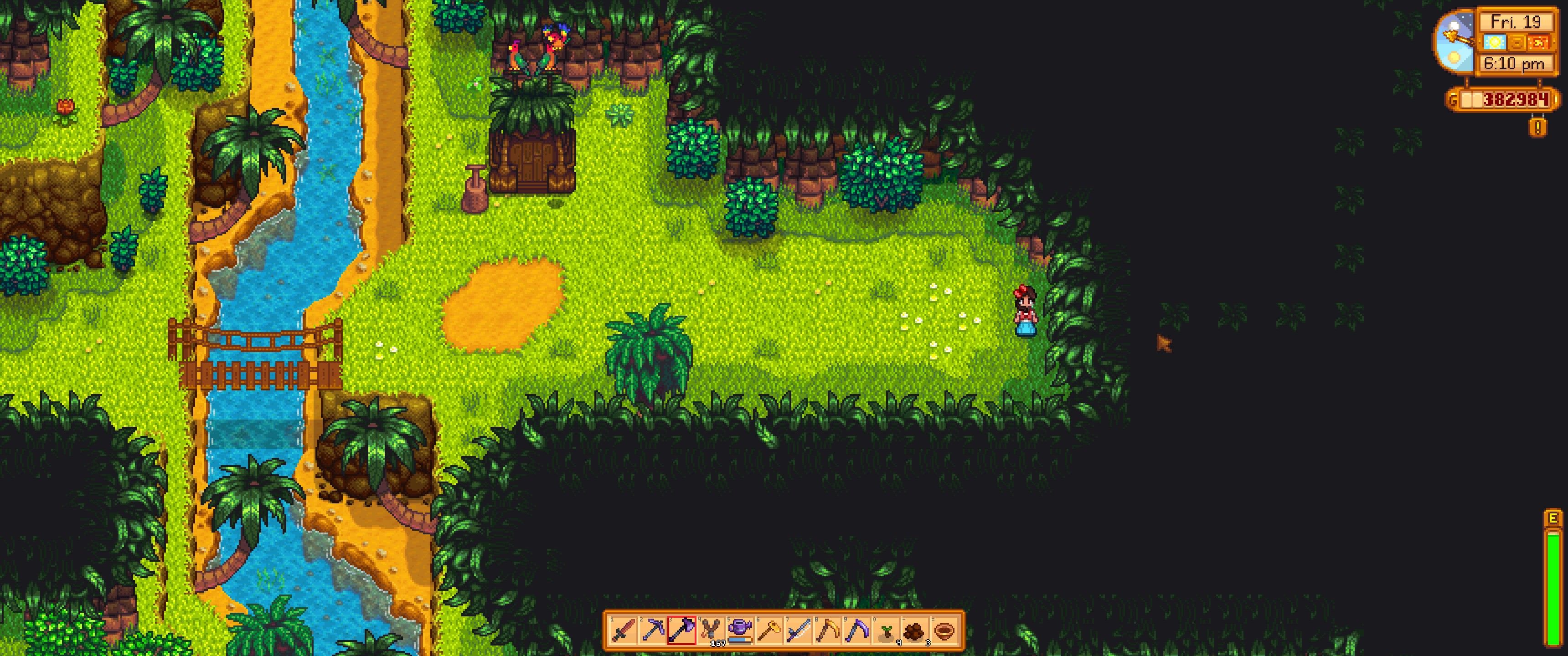 Stardew Valley: The player stands next to the entrance to the hidden walnut path